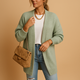 Women’s classic knitted cardigan with relaxed fit, open front, and soft breathable fabric. Perfect for layering, office wear, or casual looks.