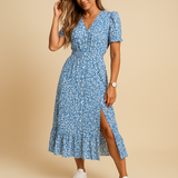 Elegant maxi dress for women with V-neck and flowy slit skirt, available in vibrant colors. Perfect for summer, vacations, and casual occasions.