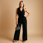 Women’s elegant wrap jumpsuit with tailored waist and wide-leg design, available in white, black, khaki, and pink. Ideal for business, formal, and stylish occasions.
