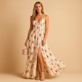 Floral maxi beach dress for women with front slit, breathable fabric, and flowing fit. Perfect for summer holidays, beach walks, and warm-weather style.