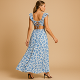 Women’s floral maxi dress with ruffles, deep V-neckline, waist cut-out, and high slit – perfect for summer weddings, parties, and evening events.