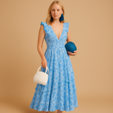 Women’s floral maxi dress with ruffles, deep V-neckline, waist cut-out, and high slit – perfect for summer weddings, parties, and evening events.