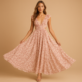Women’s floral maxi dress with ruffles, deep V-neckline, waist cut-out, and high slit – perfect for summer weddings, parties, and evening events.