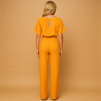 Women’s high-waist jumpsuit with lace-up waist detail, soft draping fabric, and flattering fit. Perfect for work, casual chic looks, or evenings out.