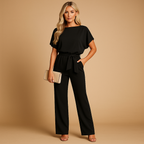 Women’s high-waist jumpsuit with lace-up waist detail, soft draping fabric, and flattering fit. Perfect for work, casual chic looks, or evenings out.