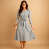 Women’s knitted autumn dress with long sleeves, round neck, and belt in beige, black, grey, red, and green – ideal for casual or office wear.