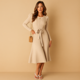 Women’s knitted autumn dress with long sleeves, round neck, and belt in beige, black, grey, red, and green – ideal for casual or office wear.