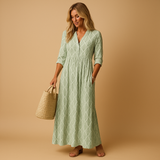 Women’s light summer dress with knee-length cut and airy fabric, perfect for spring and summer occasions from casual brunch to chic evenings.