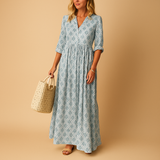 Women’s light summer dress with knee-length cut and airy fabric, perfect for spring and summer occasions from casual brunch to chic evenings.