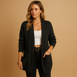 Women’s long cardigan with V-neck, relaxed fit, soft breathable fabric, and pockets. Perfect for layering, work, or casual everyday wear.