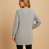 Women’s long cardigan with V-neck, relaxed fit, soft breathable fabric, and pockets. Perfect for layering, work, or casual everyday wear.
