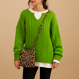 Women’s oversized chunky knit sweater with dropped shoulders, long sleeves, and soft breathable fabric. Perfect for cold days and casual layering.