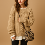 Women’s oversized chunky knit sweater with dropped shoulders, long sleeves, and soft breathable fabric. Perfect for cold days and casual layering.