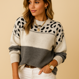Women’s oversized leopard print sweater with relaxed fit, long sleeves, and warm knit fabric. Perfect for casual streetwear and winter layering.